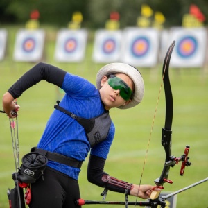 Student Eva at an Archery Competition